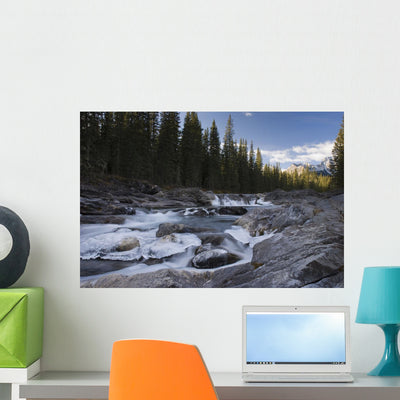 Waterfall Sheep River Wall Mural shown on a wall