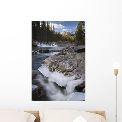 Waterfall Sheep River Wall Mural shown on a wall