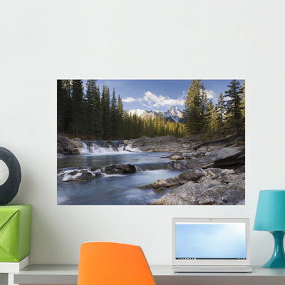 Waterfall Sheep River Wall Mural shown on a wall