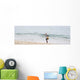 Person Walking On The Beach With A Fishing Net Wall Mural