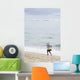 Person Walking On Beach With Fishing Net Wall Mural