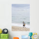 Person Walking On Beach With Fishing Net Wall Mural