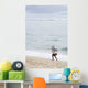Person Walking On Beach With Fishing Net Wall Mural