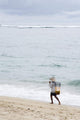 Person Walking On Beach With Fishing Net Wall Mural