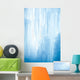 A frozen waterfall with ice in a blue and white color in winter Wall Mural