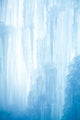 A frozen waterfall with ice in a blue and white color in winter Wall Mural