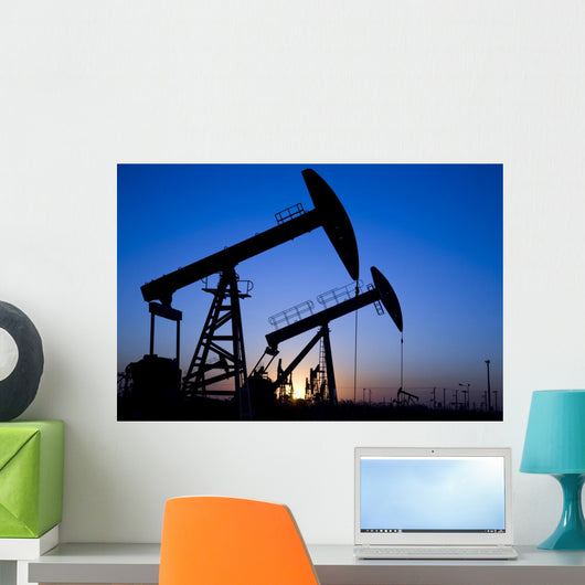Silhouette of oil pump jacks Wall Mural