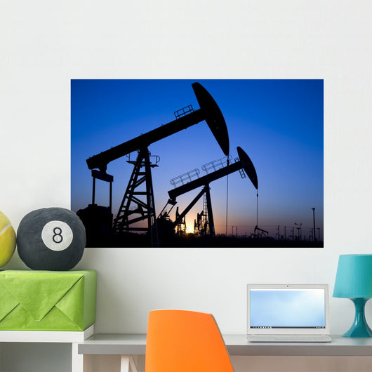 Silhouette of oil pump jacks Wall Mural
