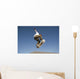 Low Angle View Of Young Male Skateboarder Wall Mural