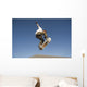 Low Angle View Of Young Male Skateboarder Wall Mural