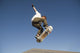 Low Angle View Of Young Male Skateboarder Wall Mural