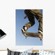 Low Angle View Of Young Male Skateboarder Wall Mural