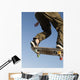 Low Angle View Of Young Male Skateboarder Wall Mural