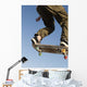 Low Angle View Of Young Male Skateboarder Wall Mural