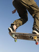 Low Angle View Of Young Male Skateboarder Wall Mural