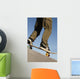 Low Angle View Of Young Male Skateboarder Wall Mural