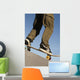 Low Angle View Of Young Male Skateboarder Wall Mural