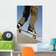 Low Angle View Of Young Male Skateboarder Wall Mural