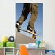 Low Angle View Of Young Male Skateboarder Wall Mural