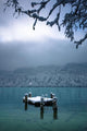 Snowy Dock Floating In Lake Wall Mural