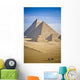 The Pyramids With Two Men On Camels Going By Wall Mural