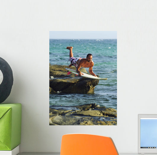 Man Jumping Into The Water On His Surf Board Wall Mural