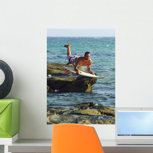 Man Jumping Into The Water On His Surf Board Wall Mural