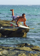 Man Jumping Into The Water On His Surf Board Wall Mural