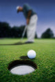 Golf Ball Near Cup Wall Mural