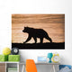 Young Grizzly Bear Walks Along Edge Of Lake At Sunset Wall Mural
