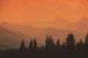 Silhouette Of Mountain Ranges And Orange Sky Wall Mural