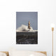 Waves Crashing Against A Lighthouse Wall Mural
