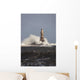 Waves Crashing Against A Lighthouse Wall Mural