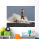 Waves Crashing Against A Lighthouse Wall Mural
