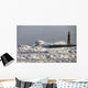 Waves Crashing Against A Pier With A Lighthouse Wall Mural
