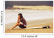 Young Woman Sitting On Her Surf Board On The Beach Wall Mural