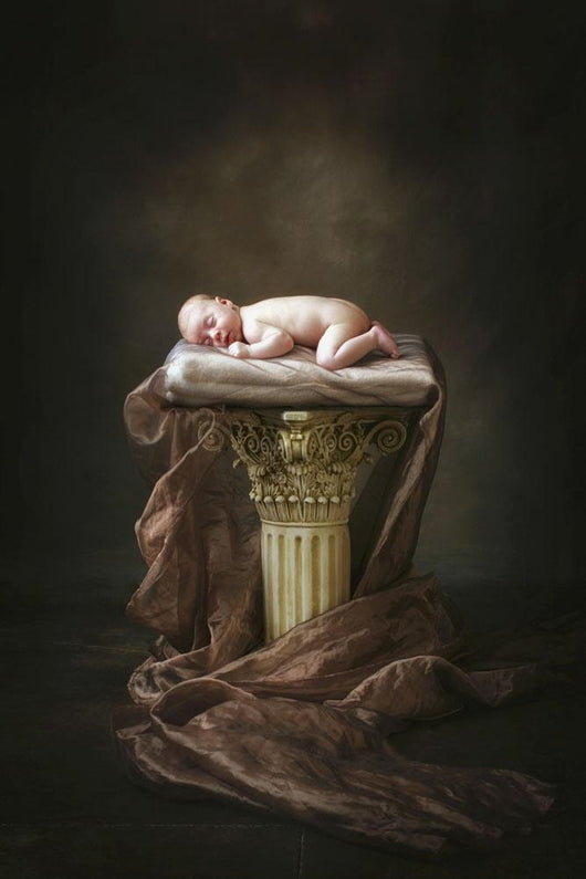 A Baby Asleep On A Pillar Wall Mural