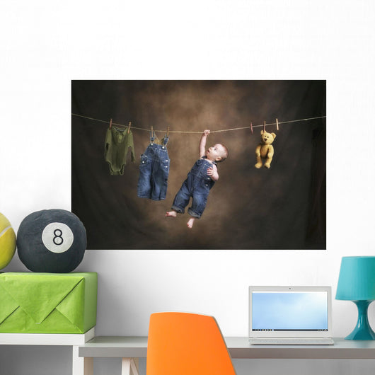 A Baby On The Clothesline Wall Mural