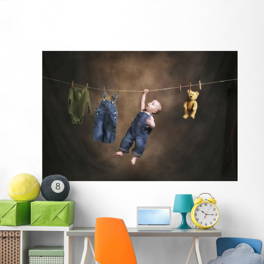 A Baby On The Clothesline Wall Mural