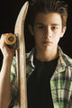 A Boy With A Skateboard Wall Mural
