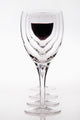 A Row Of Wine Glasses With Red Wine In The Last Glass Wall Decal