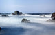 Mist Surrounding Big Rocks In The Water Wall Mural