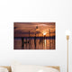 Silhouette Of Seagulls On Posts In Sea At Sunset Wall Mural