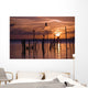 Silhouette Of Seagulls On Posts In Sea At Sunset Wall Mural