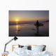 Silhouetted Surfer On Sandy Beach At Sunset Wall Mural
