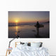 Silhouetted Surfer On Sandy Beach At Sunset Wall Mural