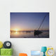 Partly Submerged And Keeling Sail Boat In Silhouette At Sunset Wall Mural