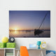 Partly Submerged And Keeling Sail Boat In Silhouette At Sunset Wall Mural