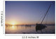 Partly Submerged And Keeling Sail Boat In Silhouette At Sunset Wall Mural