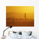 Tower Silhouetted Amongst Orange Mountains Wall Mural